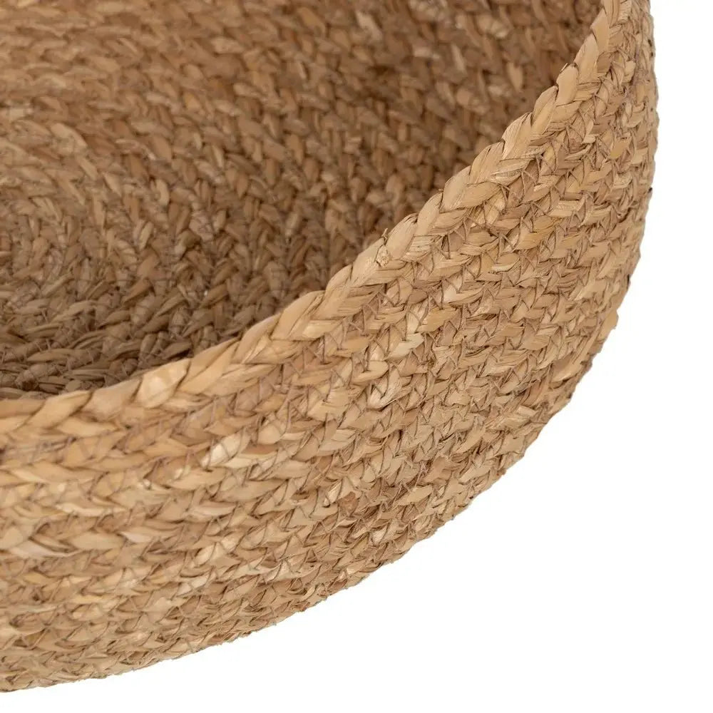 Natural fiber basket by SKAY, showcasing a woven design and earthy tones, perfect for storage or decoration.