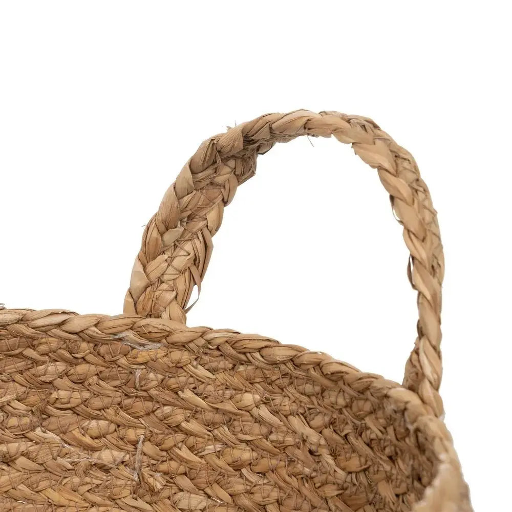 Natural fiber basket by SKAY, showcasing a woven design and earthy tones ideal for home decor or storage.