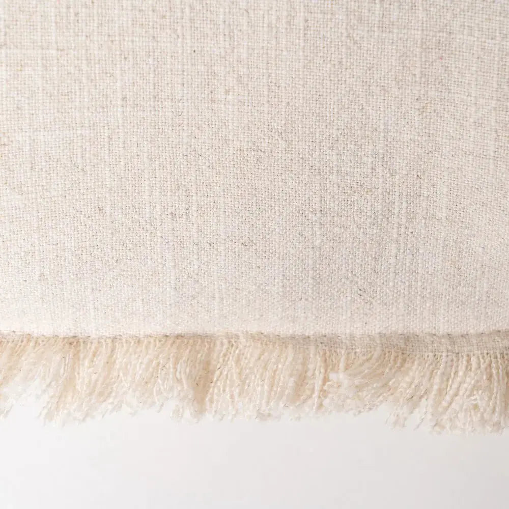 Beige cushion by SKAY, featuring a soft texture and minimalist design, perfect for home decor and comfort.