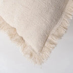 Beige cushion from Skay with a soft fabric texture, perfect for home decor and comfort.