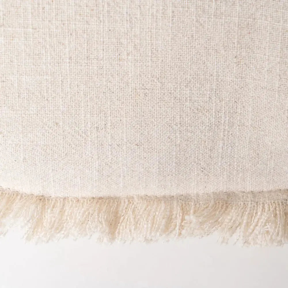 Beige cushion by Skay with a soft texture, perfect for adding comfort to any living space or decor.