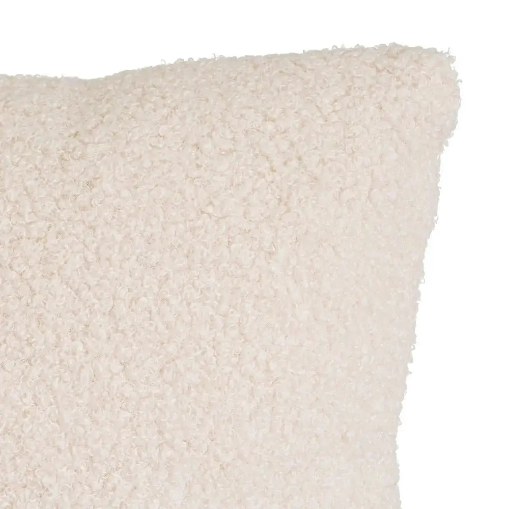 Soft SKAY sherpa bouclé cushion with textured fabric and cozy design, perfect for home decor and comfort.