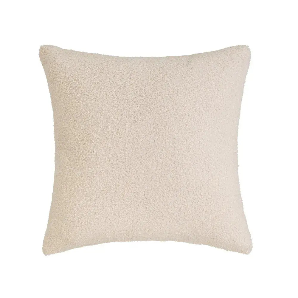 Soft SKAY sherpa bouclé cushion in a cozy texture, showcasing its plush surface and neutral color.