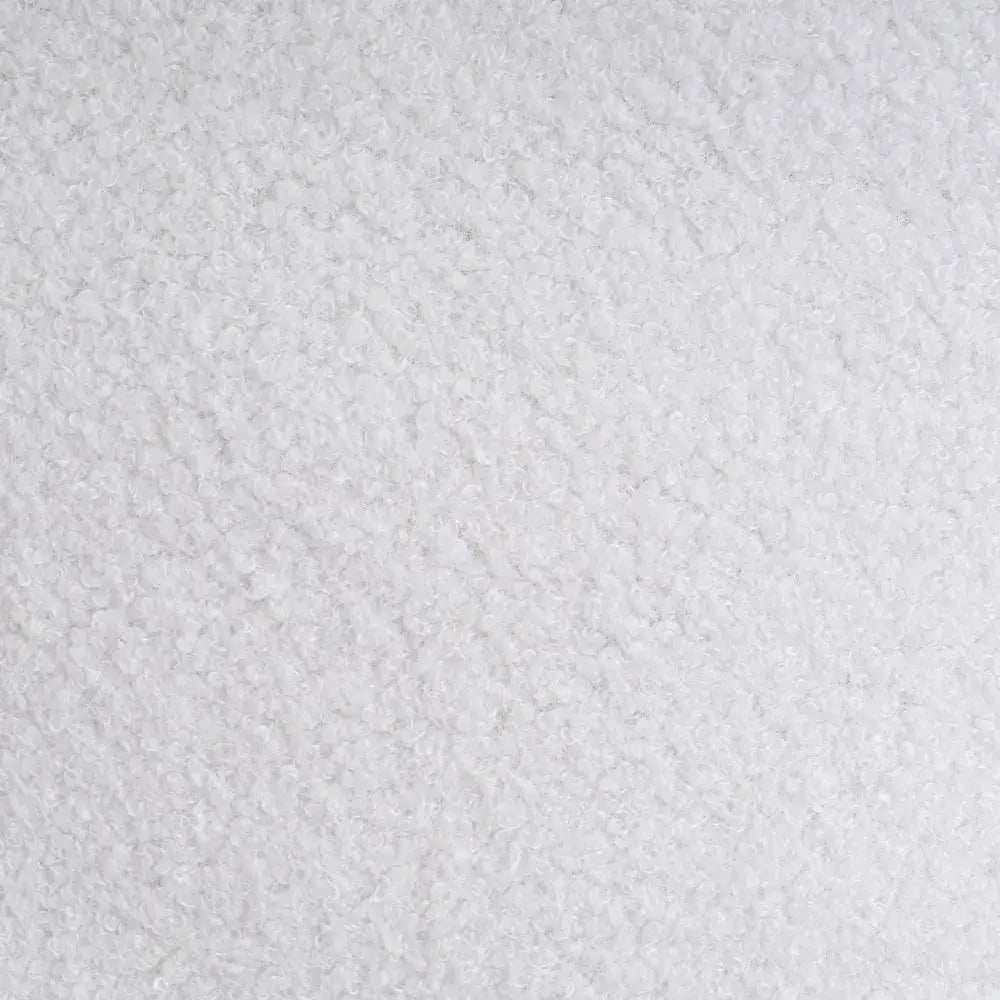 Cozy SKAY Sherpa Boucle cushion with a textured fabric and soft, plush design, perfect for adding comfort to any space.