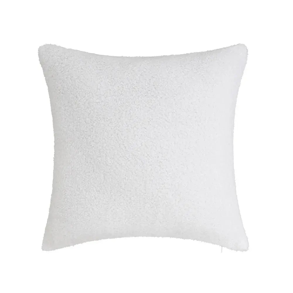 SKAY Sherpa Bouclé cushion featuring soft, textured fabric in a cozy, inviting design suitable for home decor.