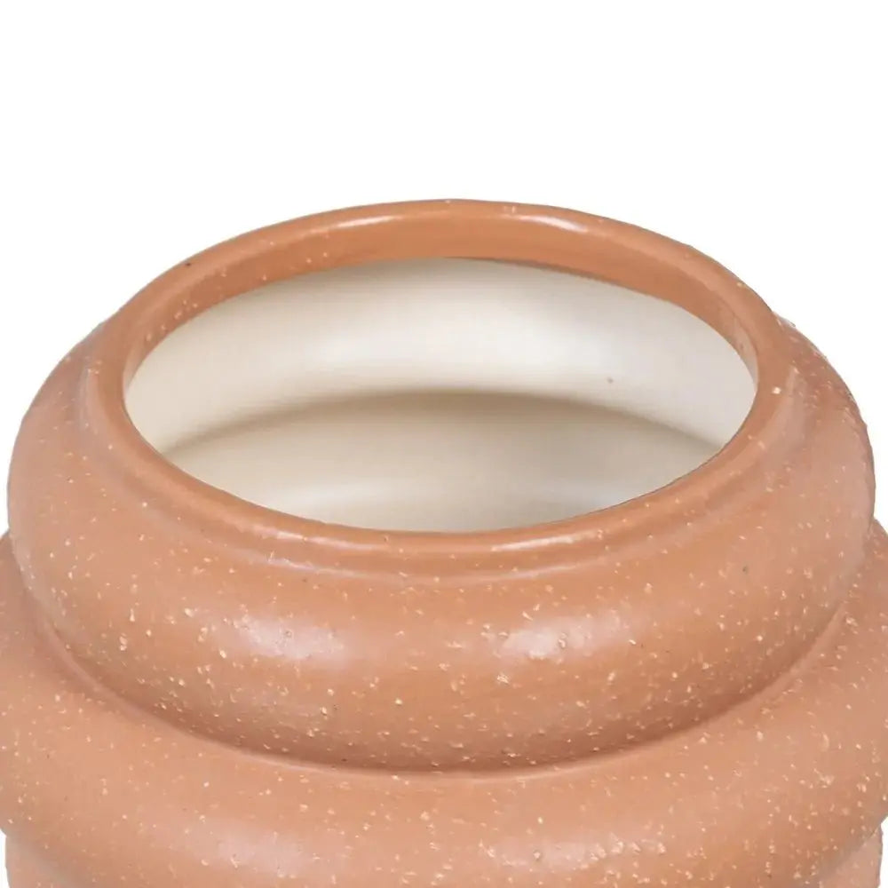 Ceramic orange vase by SKAY, featuring a smooth finish and elegant shape, ideal for home decor.