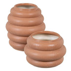 Ceramic orange vase by SKAY with a smooth finish and elegant shape, perfect for home decor or floral arrangements.