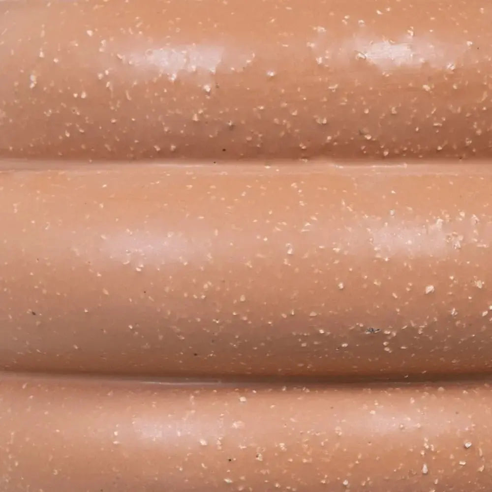 Ceramic orange vase by SKAY, featuring a smooth finish and modern design, perfect for home decor.