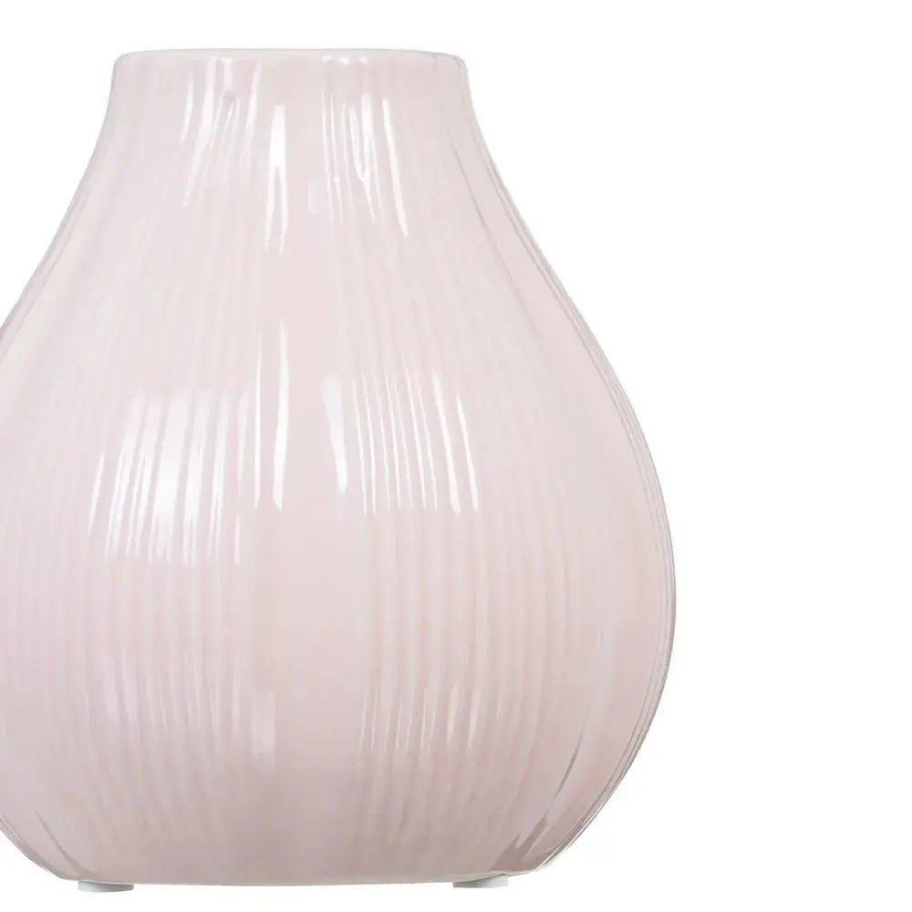 Ceramic pink vase by SKAY, featuring a smooth finish and elegant design, perfect for floral arrangements.