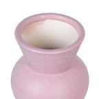 Ceramic pink vase by SKAY, showcasing a glossy finish and elegant shape, perfect for floral arrangements.