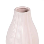 Ceramic pink vase by SKAY, featuring a smooth finish and elegant design, ideal for floral arrangements or decor.