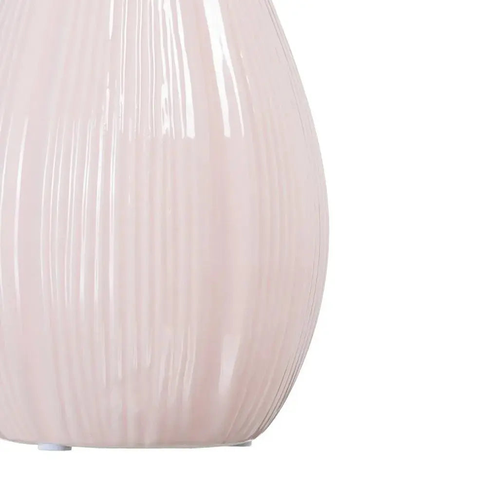 Ceramic pink vase by SKAY, showcasing a smooth finish and elegant design, perfect for floral arrangements.