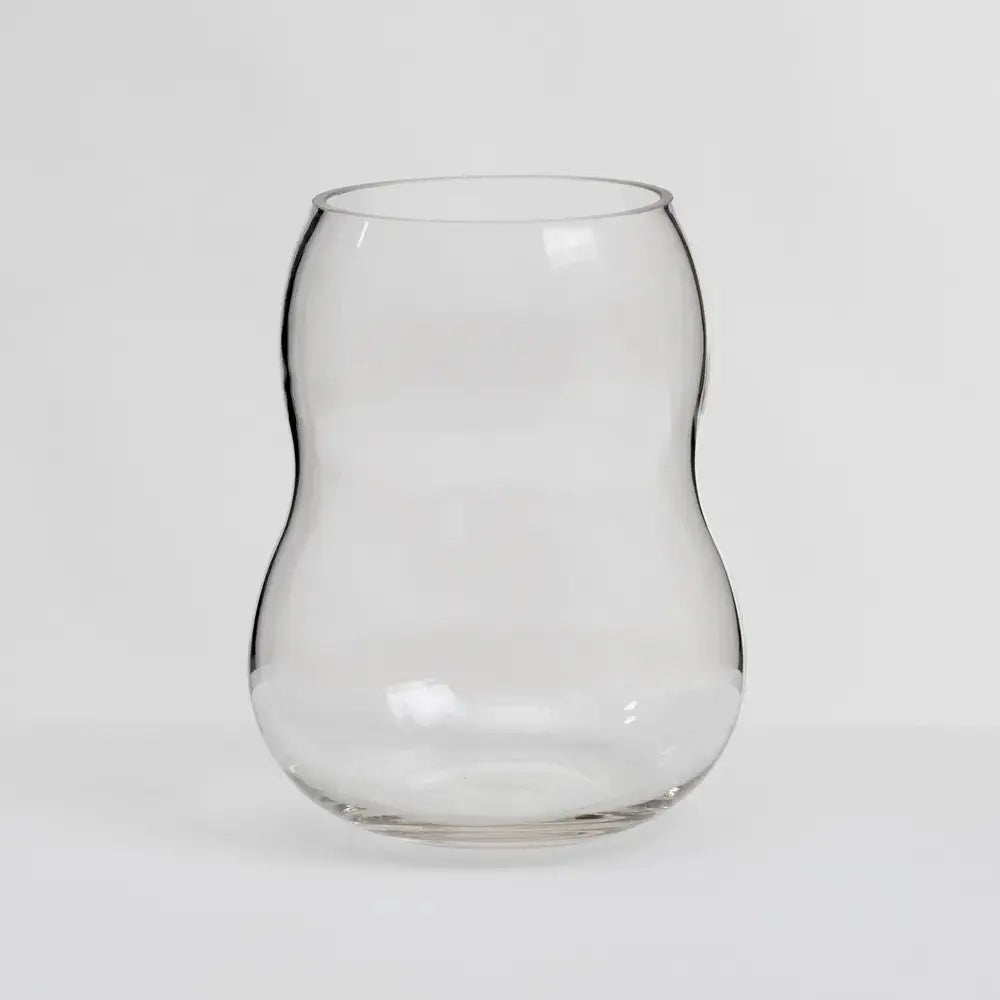 Translucent glass vase by SKAY showcasing a modern design with a sleek, curved shape and elegant finish.