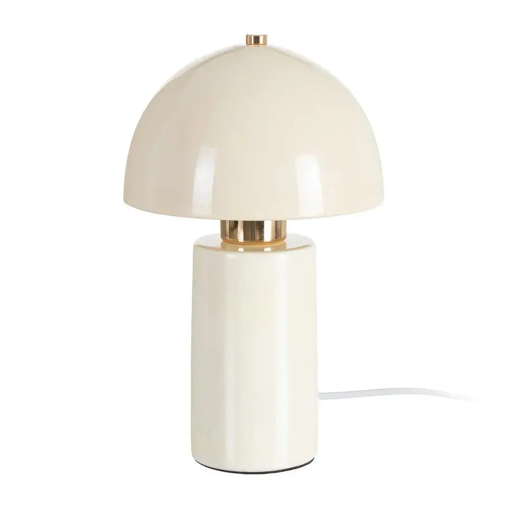 Ceramic cream table lamp by SKAY, showcasing a sleek design and warm glow, ideal for home decor.