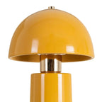 Ceramic mustard yellow table lamp by SKAY, featuring a modern design and elegant shape.