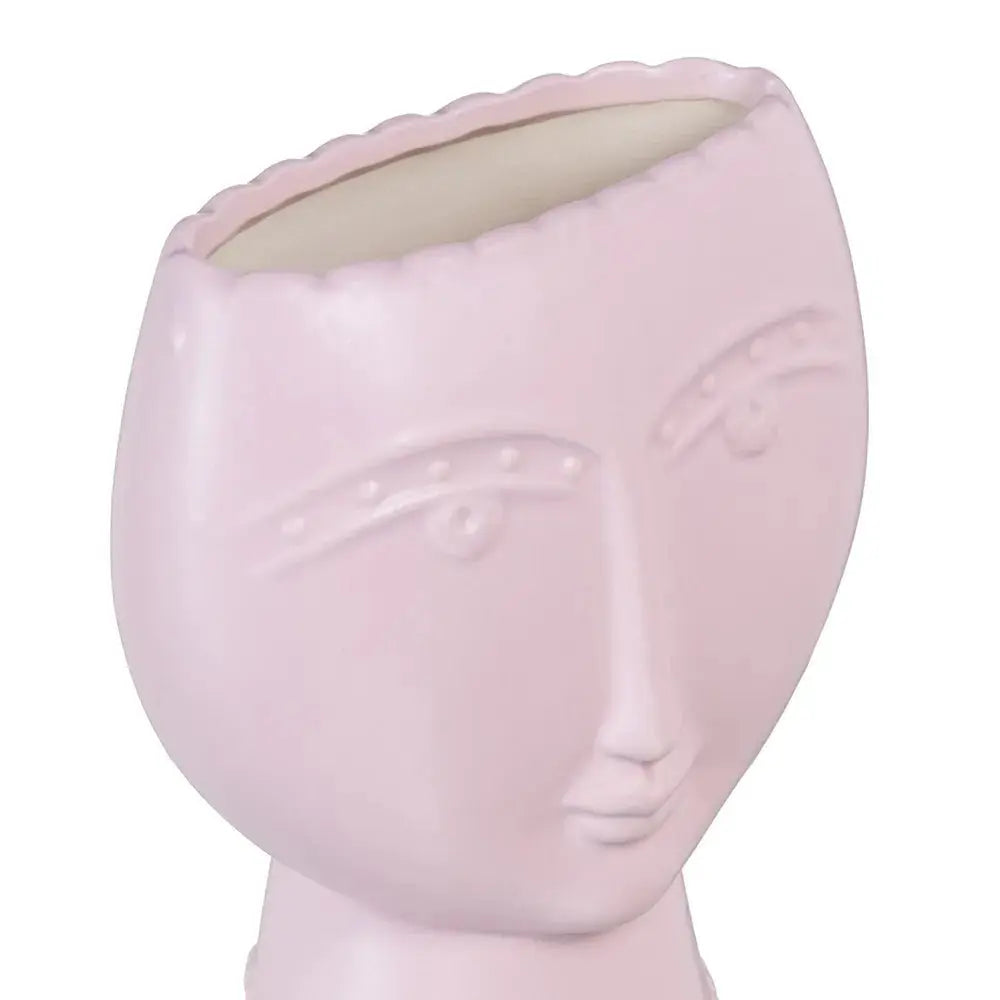 Ceramic face planter in malva color by Skay, featuring a whimsical face design and ideal for indoor plants.