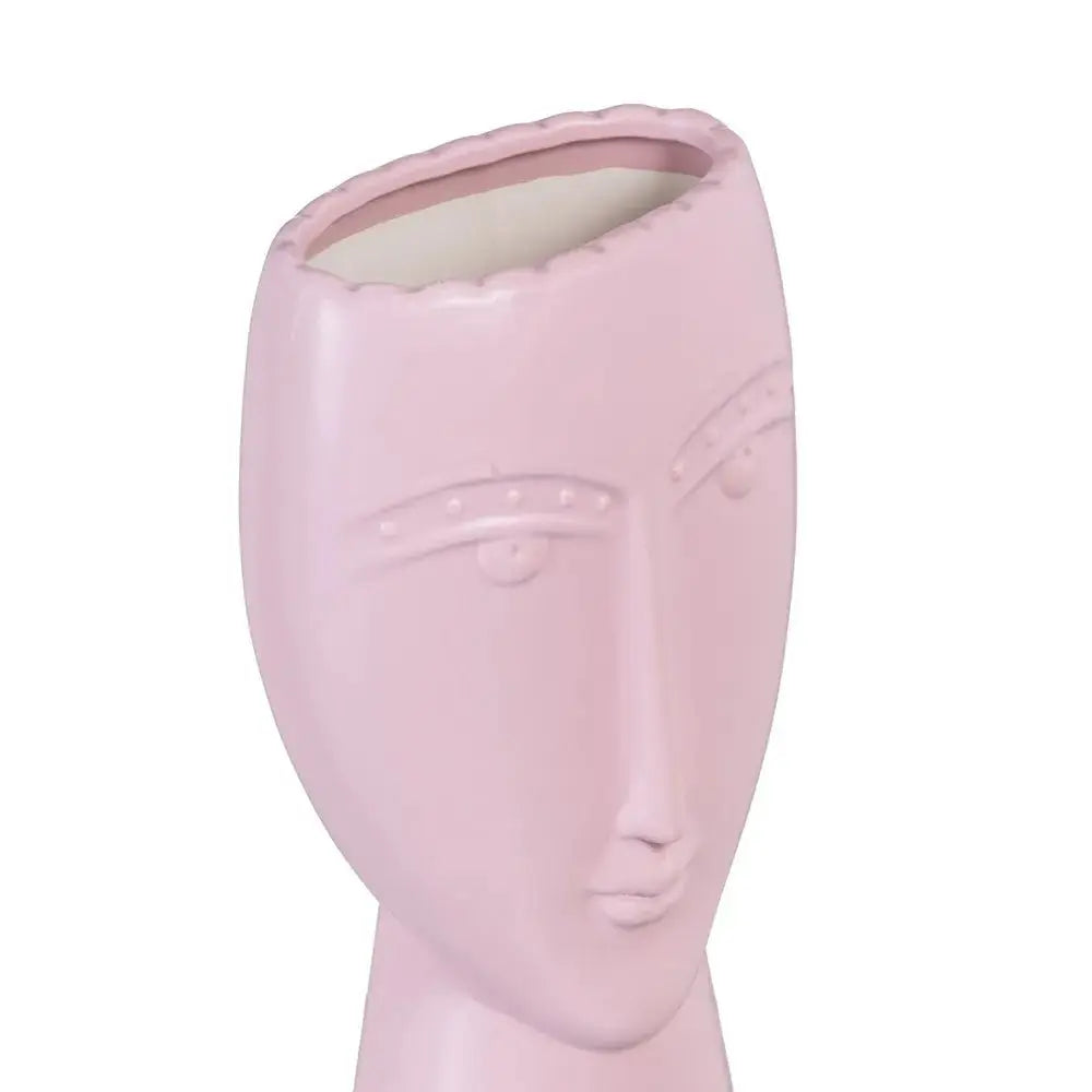 Ceramic malva face planter by SKAY, featuring a unique facial design and soft color for decorative plant display.