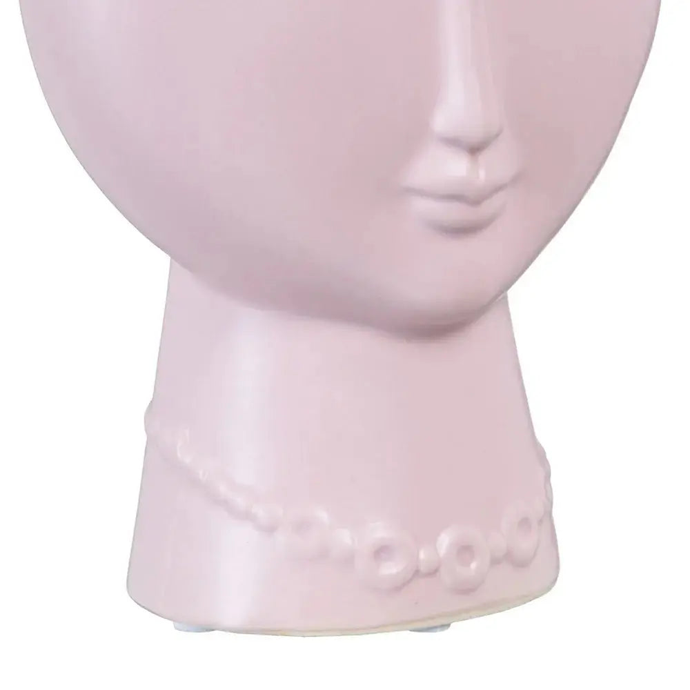 Ceramic malva face planter by Skay, featuring a unique design and vibrant color, perfect for indoor plants.