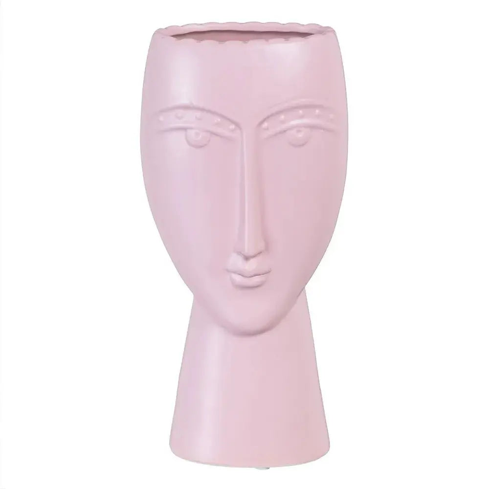 Ceramic face planter in malva color by SKAY, featuring a unique facial design and suitable for indoor plants.