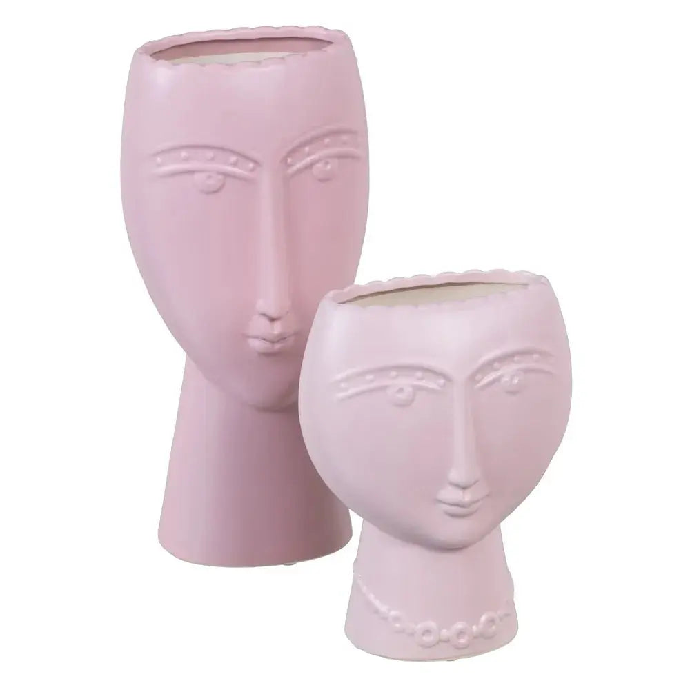 Ceramic face planter in mauve from SKAY, featuring a unique design and perfect for indoor plants.