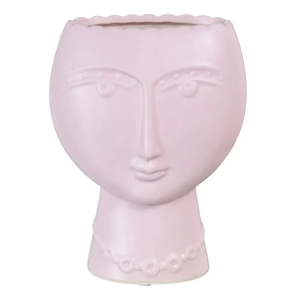 Ceramic face planter in malva color by SKAY, featuring a whimsical design with a smiling face.