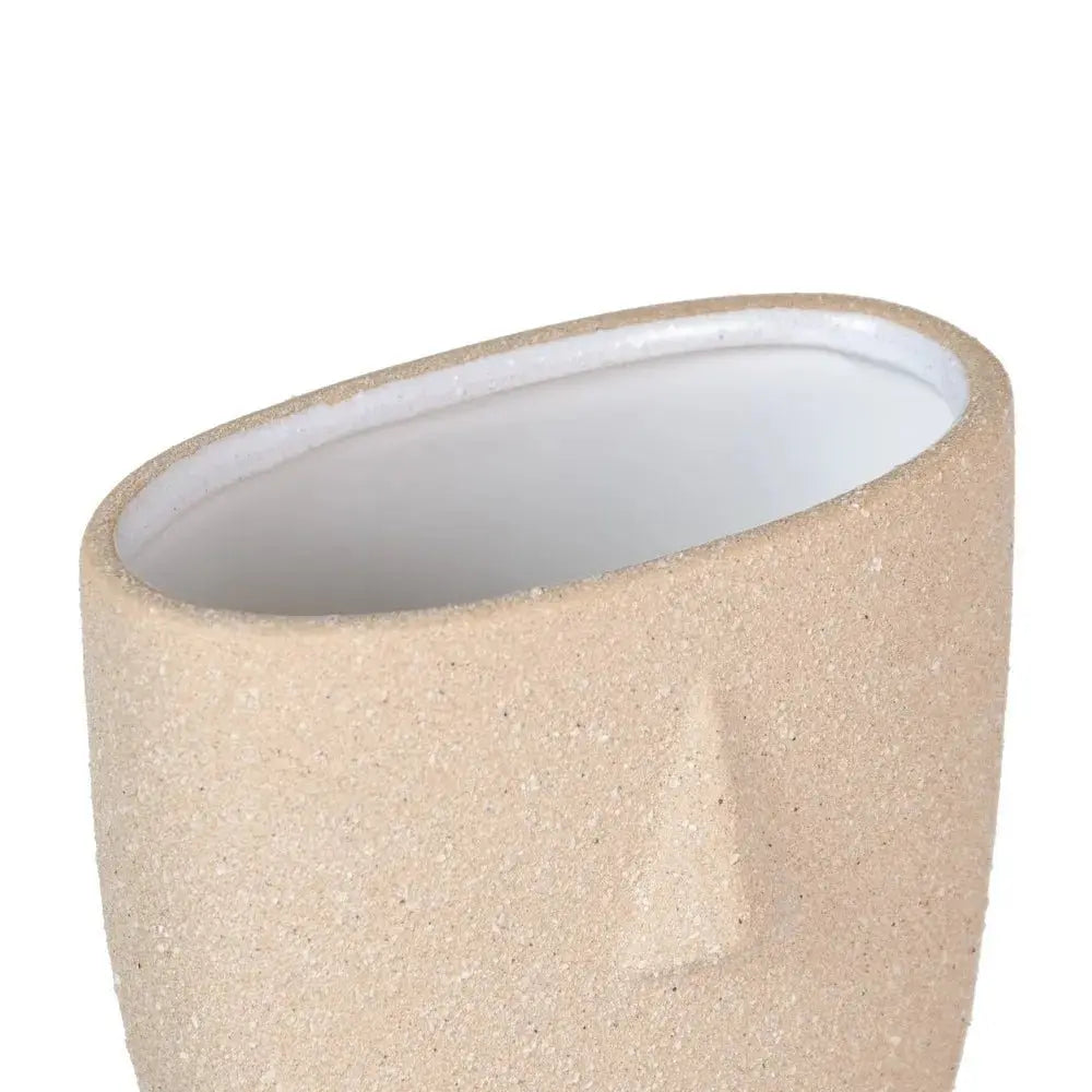 Natural ceramic planter by SKAY, featuring a sleek design and earthy tones for indoor or outdoor use.