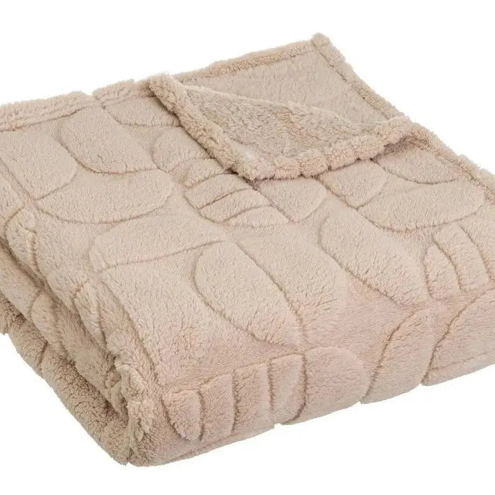 Soft SKAY jacquard blanket featuring intricate patterns and textures, ideal for cozying up or home decor.