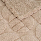 Soft SKAY jacquard blanket featuring intricate patterns and rich textures, ideal for cozying up on chilly evenings.