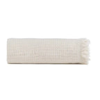 Soft cream cotton plaid blanket by SKAY, featuring a textured honeycomb pattern for cozy warmth and style.