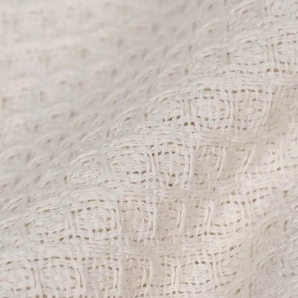 Cream cotton plaid blanket from SKAY featuring a textured honeycomb pattern.