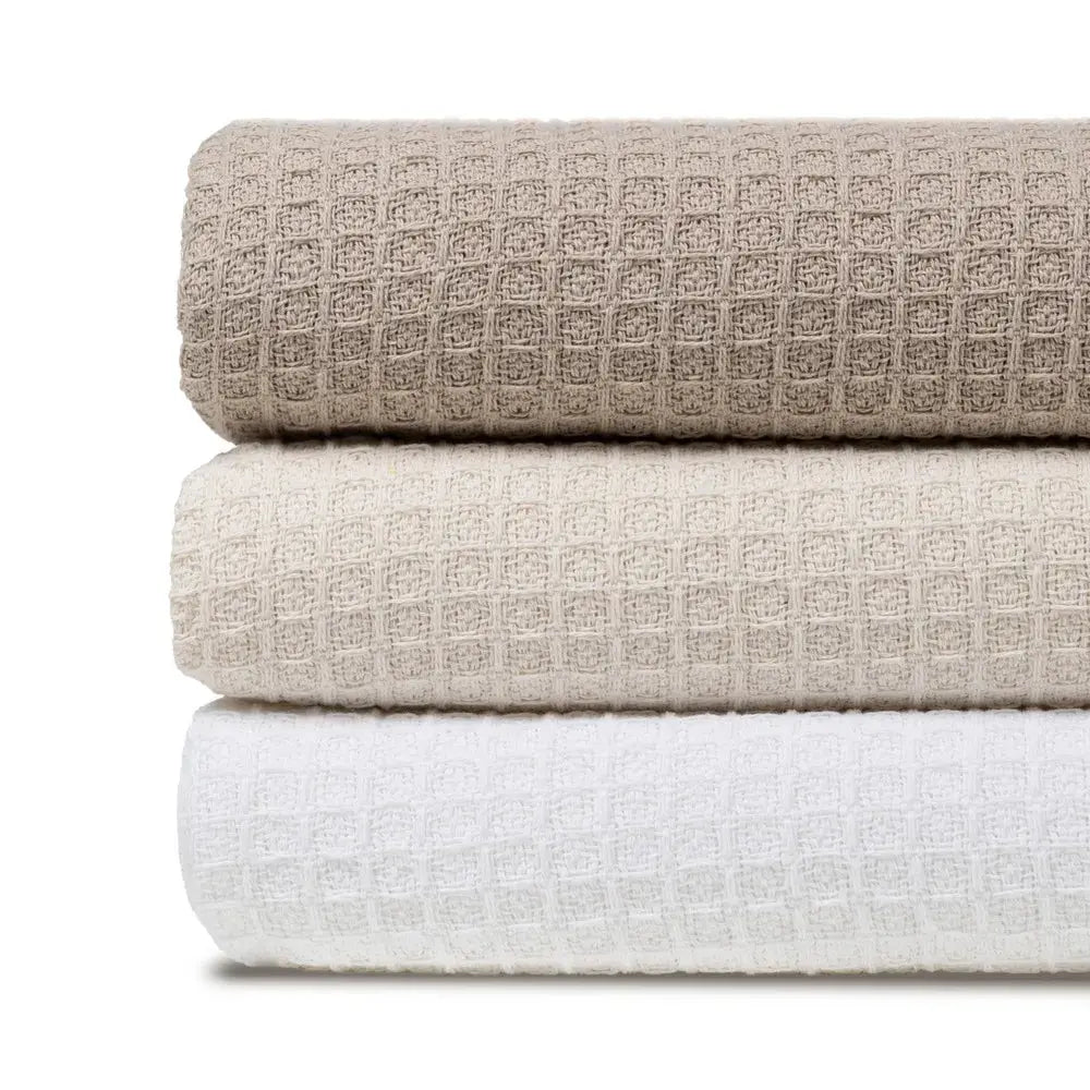 Cream cotton plaid throw blanket by SKAY with a textured honeycomb pattern.