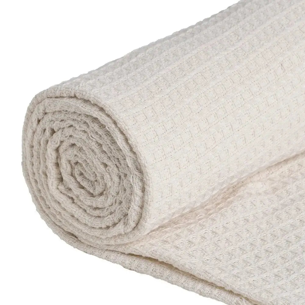 Cream cotton plaid throw blanket by SKAY, featuring a textured honeycomb pattern for added style and comfort.