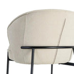 Beige fabric and metal armchair by SKAY, showcasing a modern design and comfortable seating.