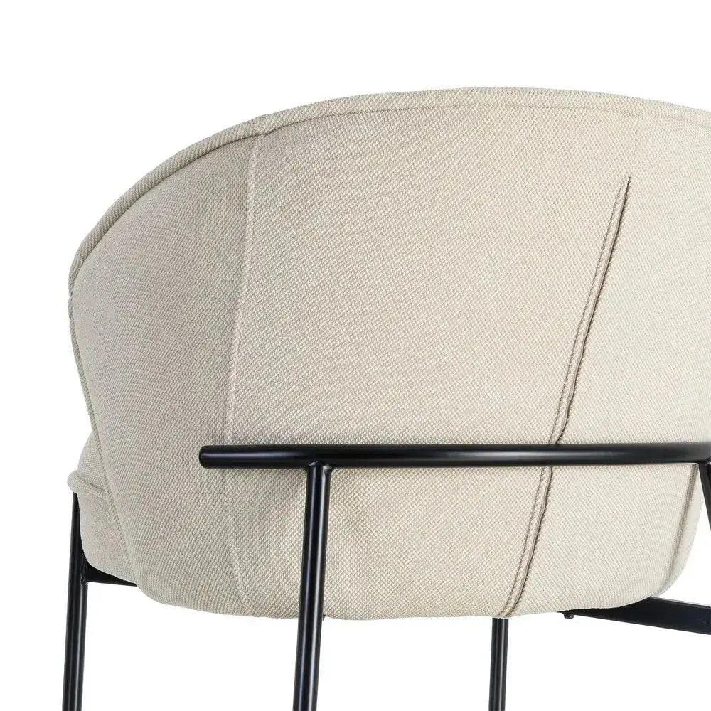 Beige fabric and metal armchair by SKAY, showcasing a modern design and comfortable seating.