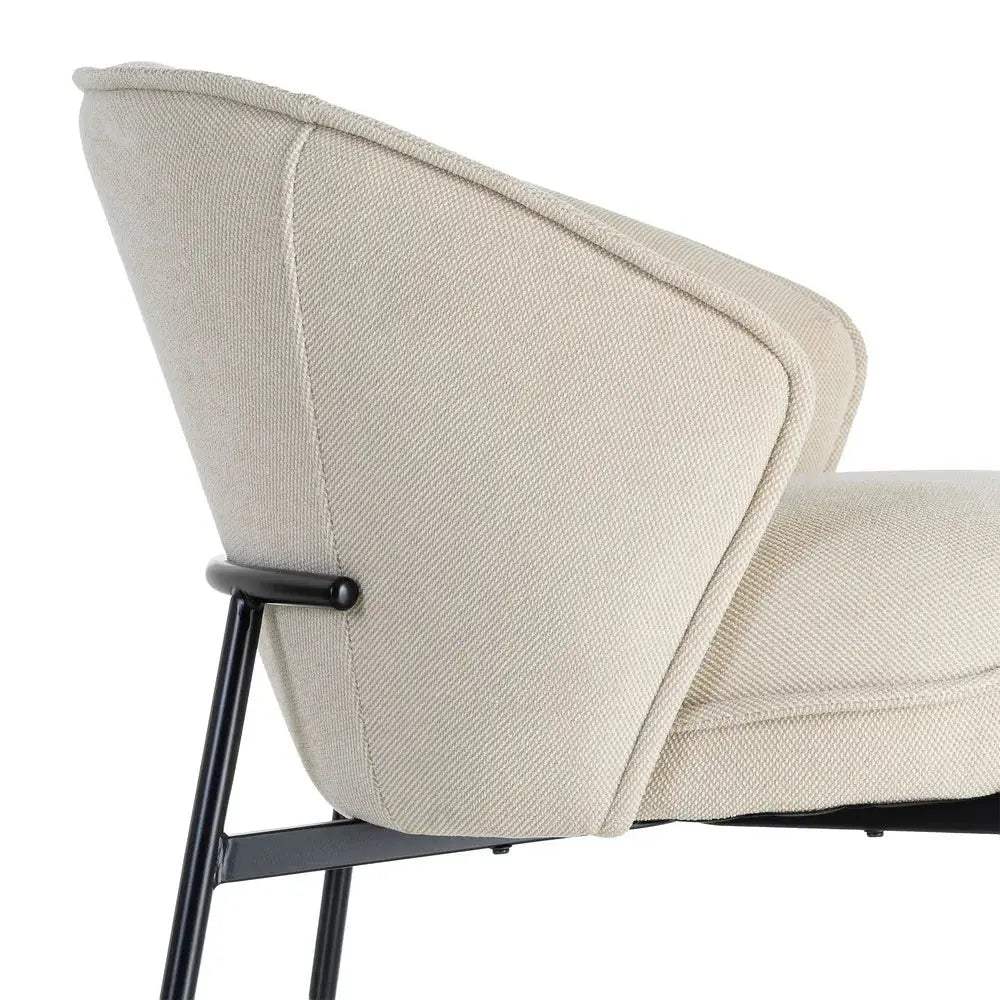Beige upholstered metal chair by SKAY, featuring a modern design and comfortable seating for home or office use.