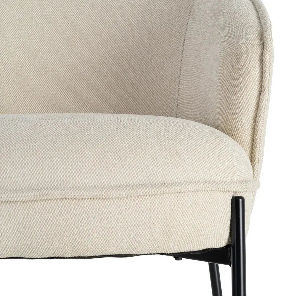 Beige SKAY armchair with a woven fabric seat and metal frame, showcasing modern design and comfortable seating.
