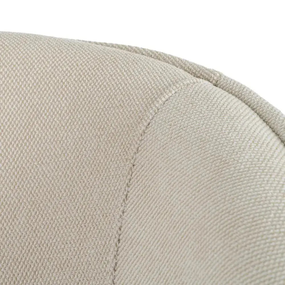 Beige upholstered armchair with metal frame by SKAY, showcasing a modern design and comfortable seating.