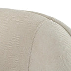 Beige upholstered armchair with metal frame by SKAY, showcasing a modern design and comfortable seating.